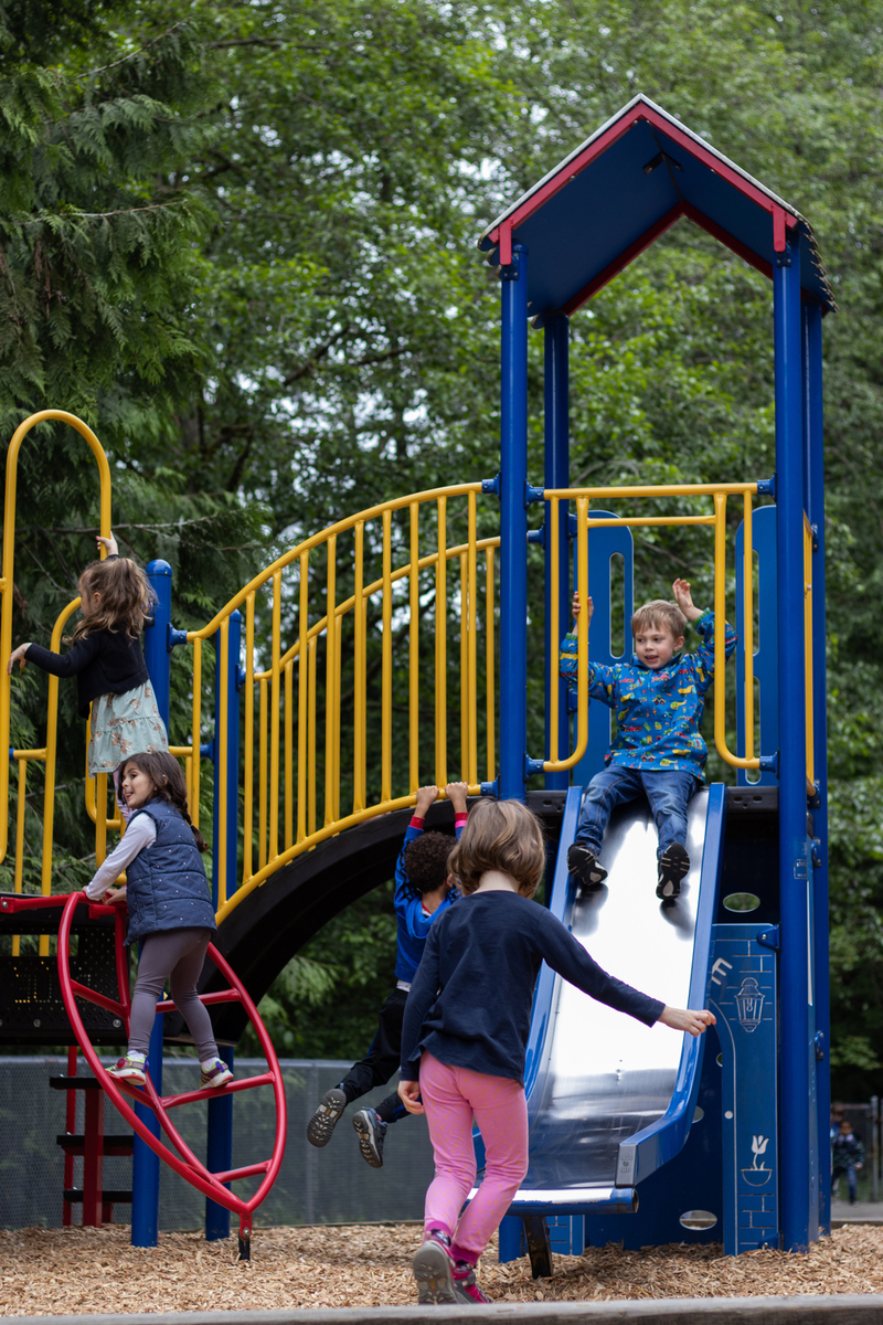 Preschool students at Cousteau School playing in the playground area